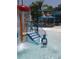 Fun splash pad with a waterfall mushroom feature and colorful playground in a resort style pool area at 710 Seminole, Clearwater, FL 33755