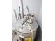 Close-up of the top of a water heater, showing the plumbing connections and Energy Guide label at 710 Seminole, Clearwater, FL 33755