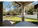 Relaxing outdoor space with tile patio, expansive lawn and trees at 818 S Main St, Brooksville, FL 34601