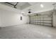 Spacious garage with epoxy flooring and an automatic garage door opener at 818 S Main St, Brooksville, FL 34601