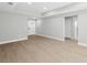 Large living room with recessed lighting, modern floors, and a bright, welcoming entrance at 818 S Main St, Brooksville, FL 34601