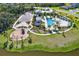Aerial view of community amenities including pool, playground, and clubhouse, set in a lush landscaped environment at 8337 Abalone Loop, Parrish, FL 34219