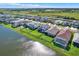 Homes with lake views, showcasing the neighborhood layout, proximity to water, and well-maintained landscaping at 8337 Abalone Loop, Parrish, FL 34219