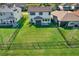 Spacious fenced backyard with lush green grass, offering privacy and room for outdoor activities and relaxation at 8337 Abalone Loop, Parrish, FL 34219