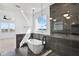 Modern bathroom featuring a soaking tub, glass shower, and stylish pendant lighting at 8337 Abalone Loop, Parrish, FL 34219