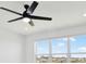 Bedroom showcasing a ceiling fan and large windows offering a view of the surrounding community at 8337 Abalone Loop, Parrish, FL 34219