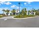 Beautiful clubhouse with manicured landscaping, palm trees, and ample parking, offering a vibrant community space at 8337 Abalone Loop, Parrish, FL 34219