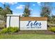 Elegant entrance sign for Isles at Bayview community, surrounded by lush landscaping, welcoming residents and visitors at 8337 Abalone Loop, Parrish, FL 34219