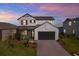 Charming two-story home featuring a modern farmhouse aesthetic and a spacious two-car garage at 8337 Abalone Loop, Parrish, FL 34219