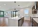 Bright kitchen with an island, stainless steel appliances, a dishwasher, and views to the outdoors at 8337 Abalone Loop, Parrish, FL 34219