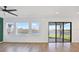Bright living room with water views seen through large windows and sliding glass doors at 8337 Abalone Loop, Parrish, FL 34219