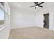 Spacious main bedroom with carpet, large window, and an en suite bathroom at 8337 Abalone Loop, Parrish, FL 34219