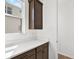 Mudroom features white countertops, dark cabinets, and a bright window for natural light at 8337 Abalone Loop, Parrish, FL 34219