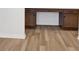 Hallway office nook with built-in desk and drawer units offers a dedicated workspace at 8337 Abalone Loop, Parrish, FL 34219