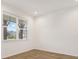 Cozy room features beautiful wood floors, a large window, and neutral paint, creating a blank canvas at 8337 Abalone Loop, Parrish, FL 34219