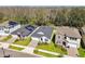 An overhead view of homes with manicured lawns in a quiet neighborhood at 9802 Carabiner Way, Land O Lakes, FL 34637