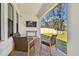 Covered back porch with outdoor furniture, providing a great view of the backyard at 9802 Carabiner Way, Land O Lakes, FL 34637