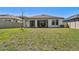 A beautiful home with a covered patio and a well-maintained, fenced backyard at 9802 Carabiner Way, Land O Lakes, FL 34637