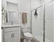 Bright bathroom featuring a glass enclosed shower, white subway tile, and a modern vanity at 9802 Carabiner Way, Land O Lakes, FL 34637