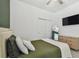 Bedroom with neutral-toned walls, closet with sliding doors, and wood dresser at 9802 Carabiner Way, Land O Lakes, FL 34637