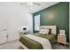 Bedroom with an accent wall, desk by the window and plush carpeting at 9802 Carabiner Way, Land O Lakes, FL 34637