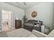 Bedroom showcasing a crib and dresser, creating a cozy space near a bathroom at 9802 Carabiner Way, Land O Lakes, FL 34637