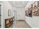 Inviting entryway with tile floors and Gathering photos on the wall at 9802 Carabiner Way, Land O Lakes, FL 34637