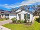 Charming single-Gathering home with a two-car garage and well-maintained landscaping at 9802 Carabiner Way, Land O Lakes, FL 34637