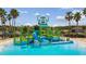 The community Splash Pad features a large water bucket, slides, and splash-friendly ground cover at 9802 Carabiner Way, Land O Lakes, FL 34637