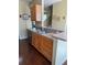 Functional kitchen area featuring wood cabinets, modern appliances, and an efficient layout, ideal for meal preparation at 10002 Bradwell Pl, Tampa, FL 33626