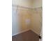Spacious walk-in closet with wire shelving and neutral carpeting; ideal for organized storage solutions at 10002 Bradwell Pl, Tampa, FL 33626