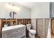 Clean bathroom featuring a white vanity with sink, toilet, and light fixtures at 103 W North Branch Rd, Ruskin, FL 33570