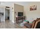 Comfortable living room with tile floors, stylish decor, and an open doorway leading to the kitchen area at 1055 82Nd N Ter # 1055A, St Petersburg, FL 33702