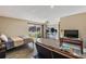 Open concept living space with bed, living, and kitchen areas, tile floors, and access to outdoor space at 1055 82Nd N Ter # 1055A, St Petersburg, FL 33702
