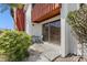 Cozy outdoor patio with seating, offering a relaxing space with nearby greenery and sliding glass door at 1055 82Nd N Ter # 1055A, St Petersburg, FL 33702