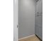 Hallway linen closet featuring wood-look floors and gray shelving at 1055 82Nd N Ter # 1055A, St Petersburg, FL 33702