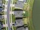 An aerial view of a home surrounded by a fenced backyard and green spaces at 10934 Sundrift Dr, Tampa, FL 33647