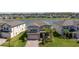 Beautiful home in a lakeside community with manicured lawns and paver driveway near other upscale homes at 10934 Sundrift Dr, Tampa, FL 33647