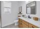 A bathroom with a vanity, a mirror, and a shower at 10934 Sundrift Dr, Tampa, FL 33647