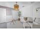 Charming Bedroom with modern light fixture, white crib, and accent wall at 10934 Sundrift Dr, Tampa, FL 33647