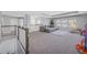 A spacious and bright upper living area with a large sectional couch and outdoor views at 10934 Sundrift Dr, Tampa, FL 33647
