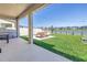 Outdoor patio with modern furniture, a grill, and lake views at 10934 Sundrift Dr, Tampa, FL 33647