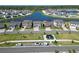 Beautiful aerial view of homes surrounding a picturesque lake, showcasing community layout and serene setting at 12851 Tortoise Shell Pl, Riverview, FL 33579