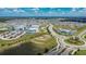 Aerial view of a well-planned community with schools, homes, and community amenities at 12851 Tortoise Shell Pl, Riverview, FL 33579