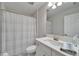 Bathroom featuring a shower, toilet, vanity with white cabinets and lots of natural light at 12851 Tortoise Shell Pl, Riverview, FL 33579