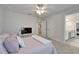 Bedroom featuring neutral colored walls, carpeted floors, a ceiling fan and a connecting bathroom at 12851 Tortoise Shell Pl, Riverview, FL 33579