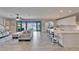 A large living area seamlessly flows into the kitchen and includes bar stool seating at 12851 Tortoise Shell Pl, Riverview, FL 33579