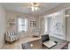 Bright and airy office features wood floors, striped chairs, and natural light at 12851 Tortoise Shell Pl, Riverview, FL 33579