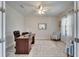 Bright home office with a ceiling fan, wood flooring, and a view of the window at 12851 Tortoise Shell Pl, Riverview, FL 33579