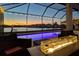 Enjoy an evening swim in the stunning pool with a fire feature at 12851 Tortoise Shell Pl, Riverview, FL 33579
